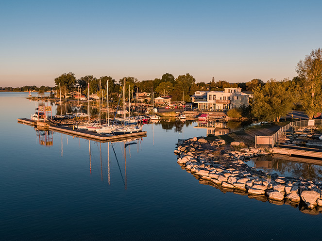 Drone view of Brighton Marina showing boats and restaurant at sunset