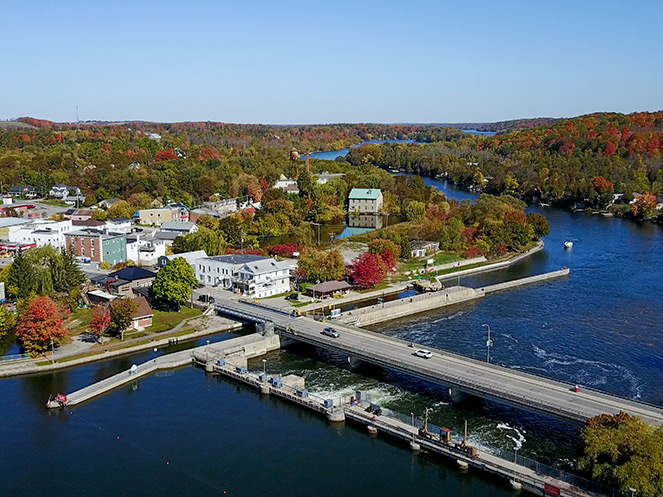 Drone view of bridge into Hastings and village of Hastings in summer